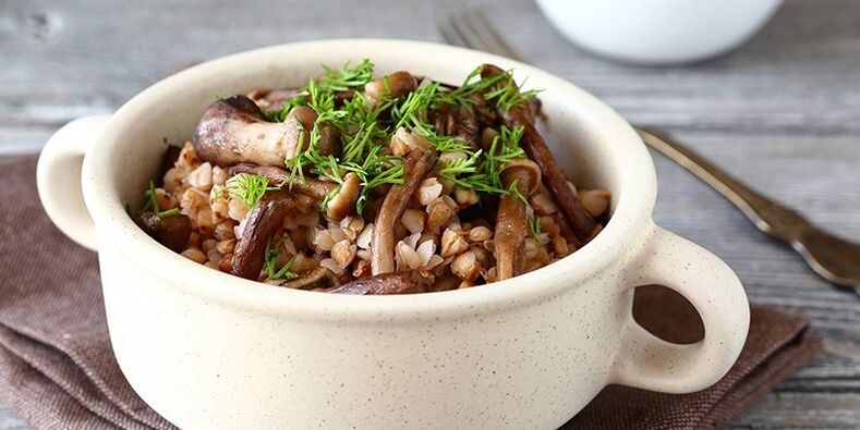 Buckwheat porridge with mushrooms for lunch in the healthy nutritional menu